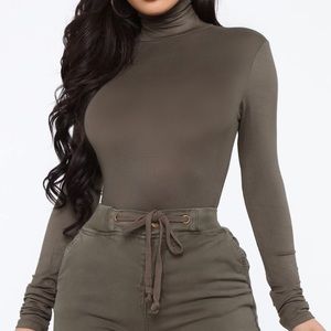 NEVER WORN. Olive green turtleneck top, shirt.